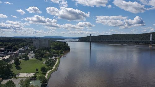 High angle view of bridge over river in city against sky