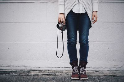 Full length of a young woman standing on floor