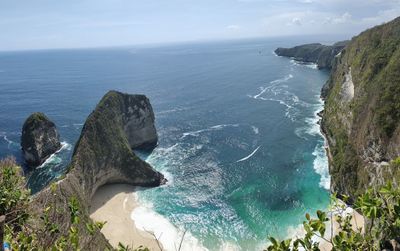 High angle view of rocks in sea against sky