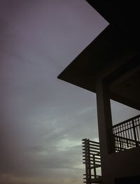 Low angle view of silhouette built structure against sky