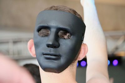 Close-up portrait of man with mask