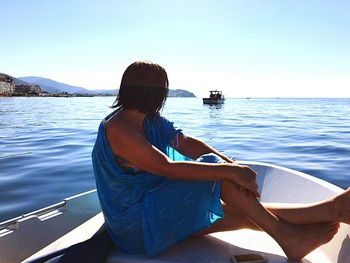 People sitting on boat in sea