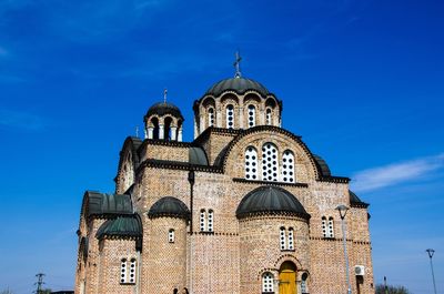 Low angle view of cathedral against blue sky