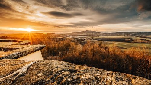 Aerial view of landscape against sky during sunset