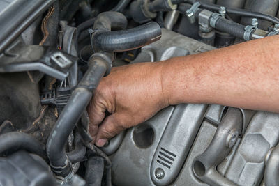 Close-up of man working on car