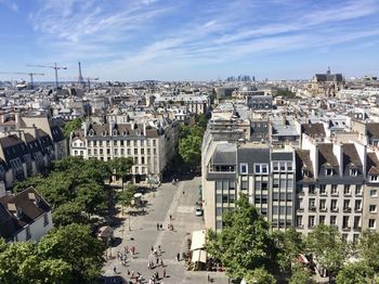 High angle view of buildings in city against sky