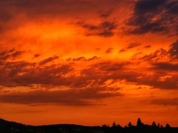 Low angle view of dramatic sky during sunset