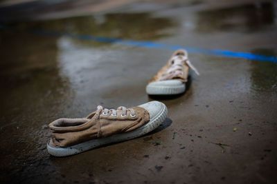 Close-up of shoes on the ground