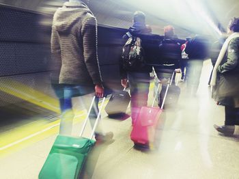 Blurred motion of people on escalator