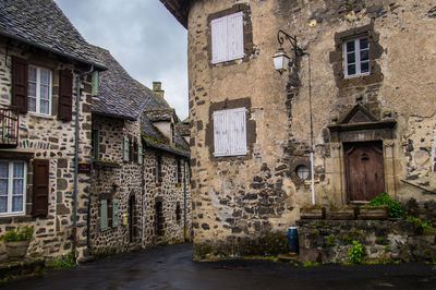 Alley amidst old buildings in town