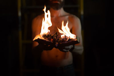 Close-up of burning candle