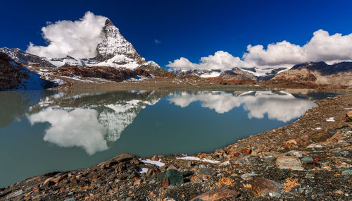 Scenic view of snowcapped mountains against sky