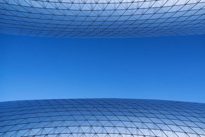 Low angle view of building against blue sky