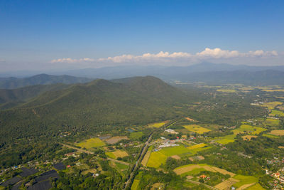 Scenic view of agricultural landscape against sky