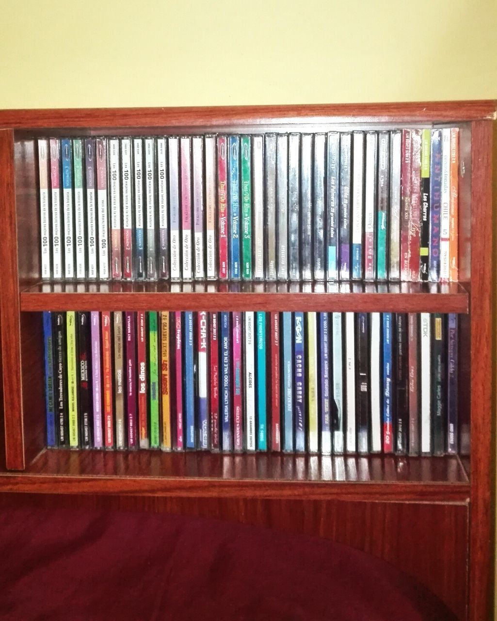 indoors, multi colored, in a row, variation, order, arrangement, large group of objects, education, shelf, book, still life, abundance, wood - material, choice, side by side, no people, colorful, collection, bookshelf, window