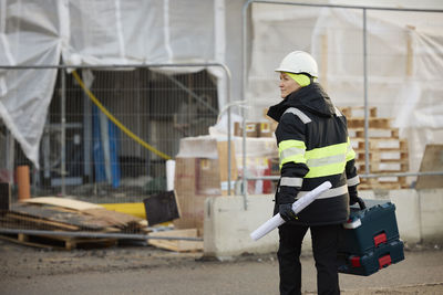 Rear view of engineer at building site