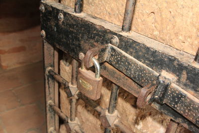 High angle view of rusty metal on wood