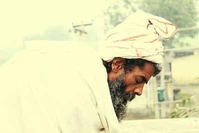 Side view of priest looking down