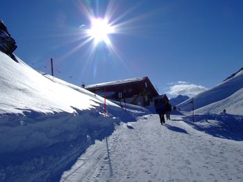 View of ski lift on snowcapped mountain