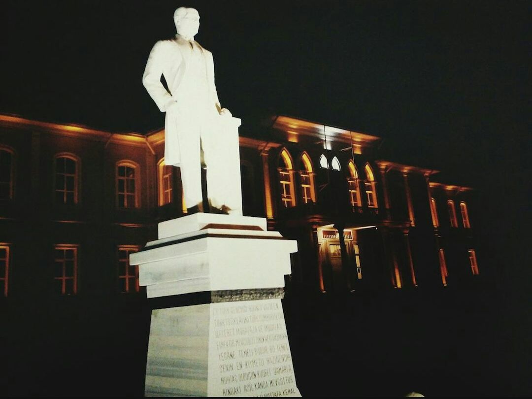 architecture, built structure, religion, night, spirituality, place of worship, illuminated, building exterior, low angle view, statue, church, human representation, sculpture, famous place, art and craft, travel destinations, architectural column