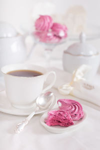 Close-up of ice cream in cup on table