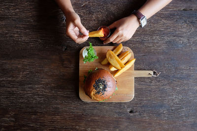 High angle view of man preparing food on table