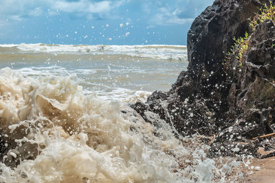 Sea waves splashing on rocks