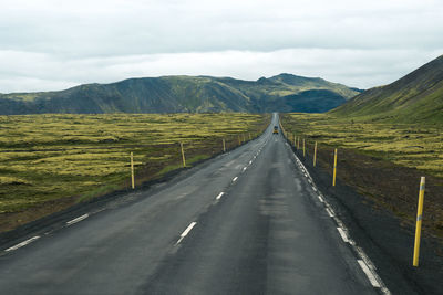 Empty road or highway in the natural environment of iceland on a cloudy day
