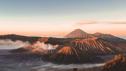 Scenic view of mountains against sky during sunset