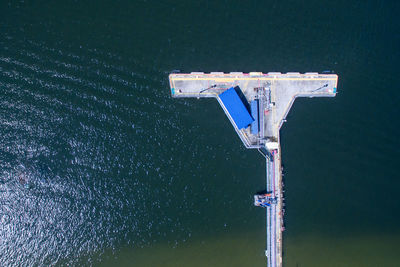 High angle view of pole by lake