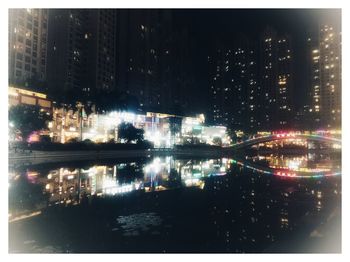 Digital composite image of illuminated buildings in city at night