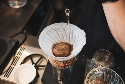 Barista dripping coffee and slow coffee bar style