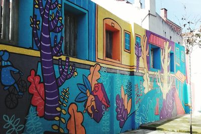 Low angle view of graffiti on wall of building