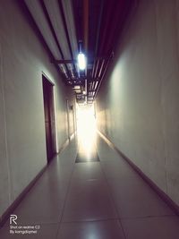 Illuminated corridor of building