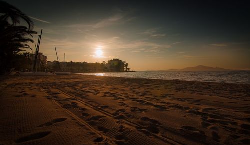 Scenic view of beach at sunset