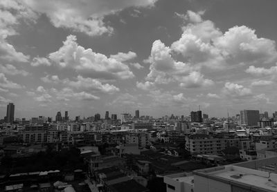 High angle view of city against cloudy sky