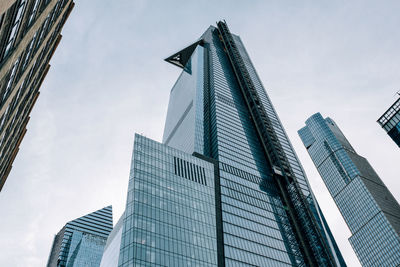 Low angle view of modern buildings against sky in city