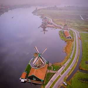 High angle view of ferris wheel by river