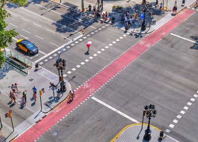 High angle view of people crossing road