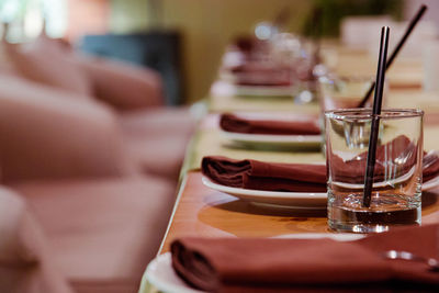Close-up of place setting on table in restaurant