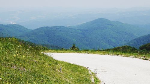 Landscape with mountain range in the background