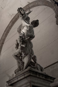 Low angle view of statue against building