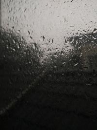 Close-up of wet window in rainy season