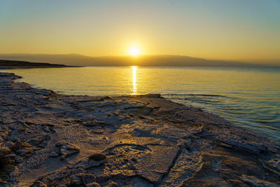 Dead sea salt mushrooms beach  against sky on sunrise 