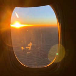Scenic view of sea seen through airplane window