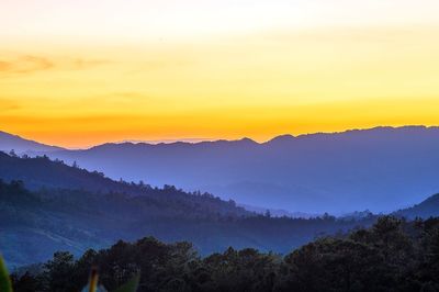 Scenic view of mountains at sunset