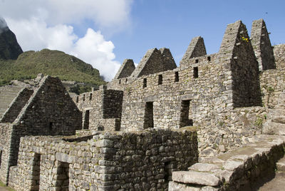 View of old building against cloudy sky