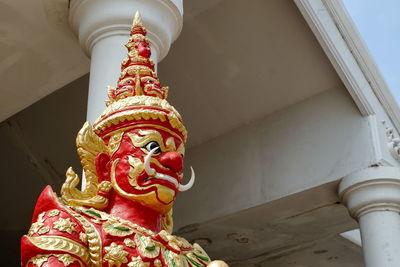 Low angle view of statue against building