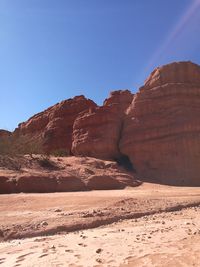 Rock formations in desert against clear sky