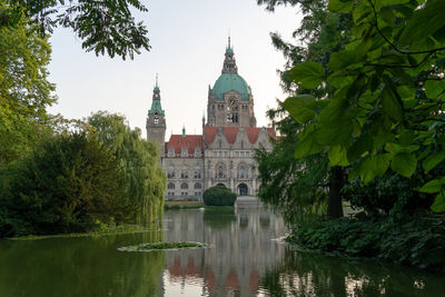 Reflection of trees and buildings in water